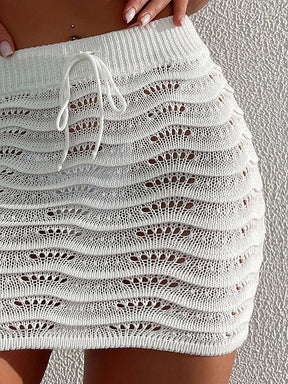 Praia moda elegante saia cor sólida oco biquíni bloqueado saia curta de malha