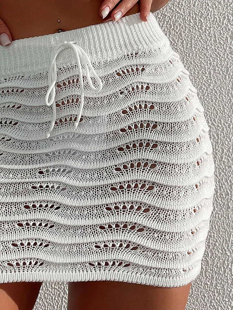 Praia moda elegante saia cor sólida oco biquíni bloqueado saia curta de malha
