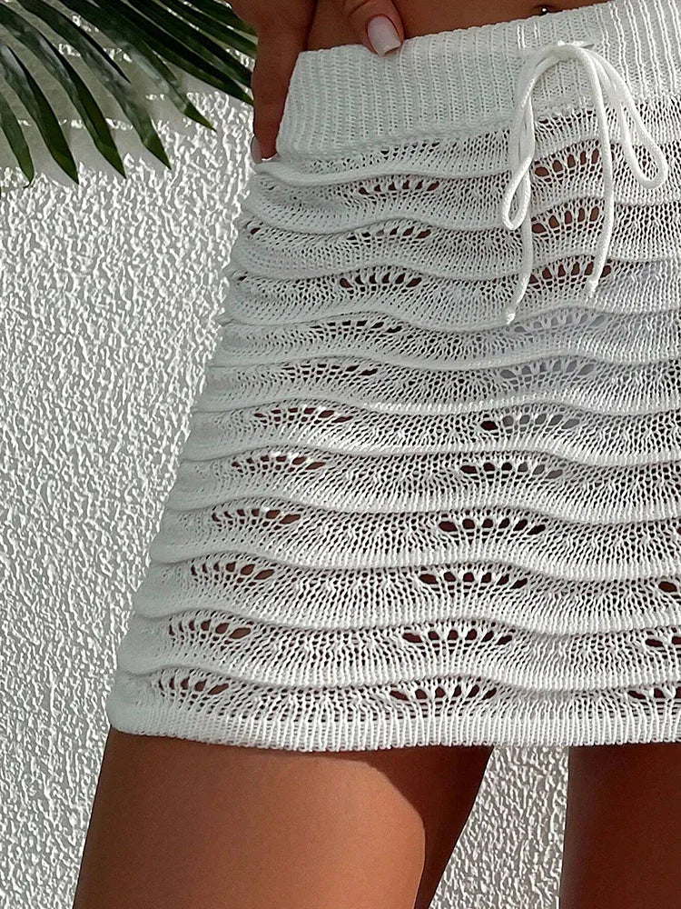Praia moda elegante saia cor sólida oco biquíni bloqueado saia curta de malha